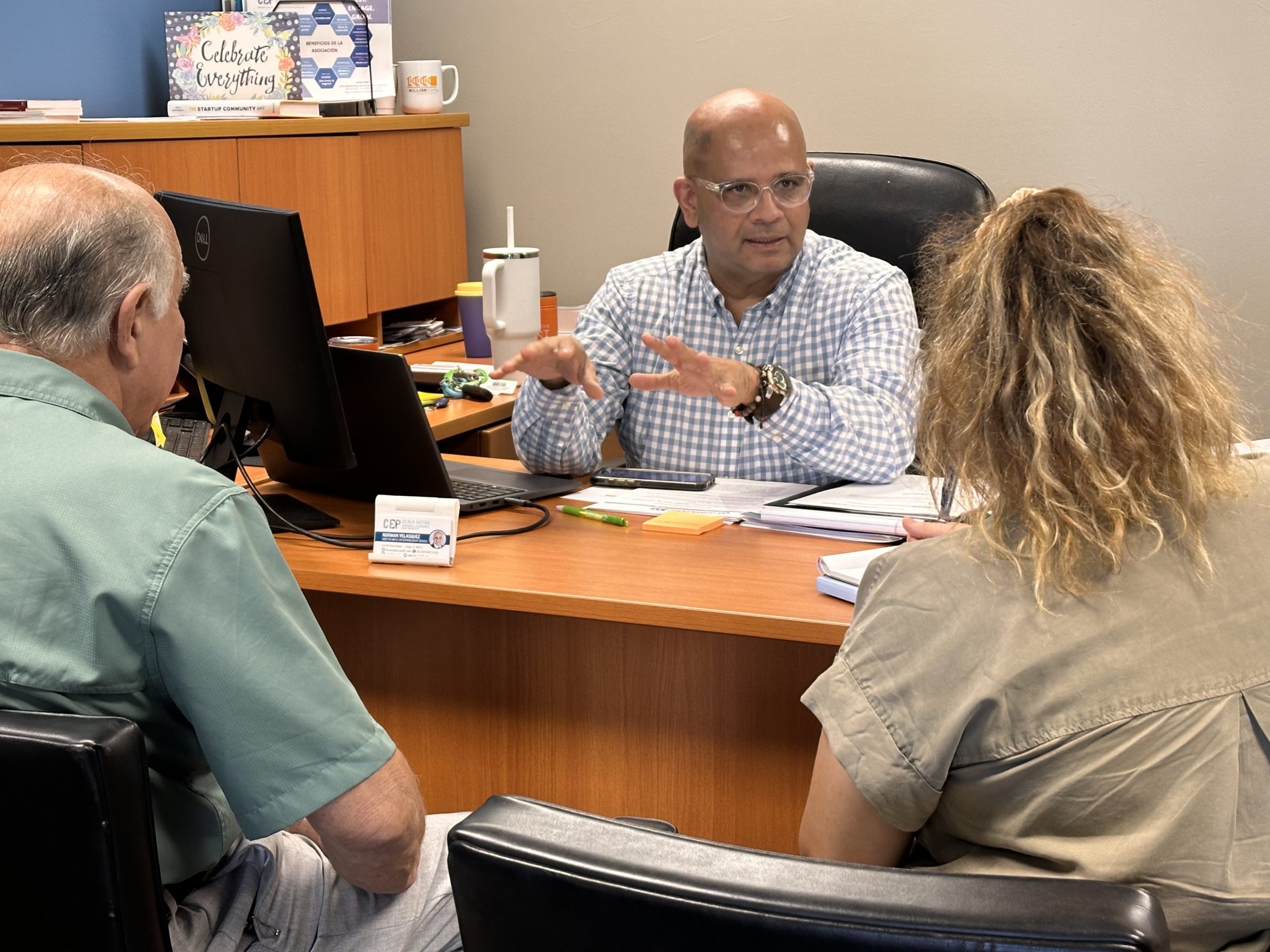 Norman consulting with a business owner